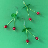 Cherries ornament made from green wire, plastic leaves, and vintage glass beads. 3" tall. 