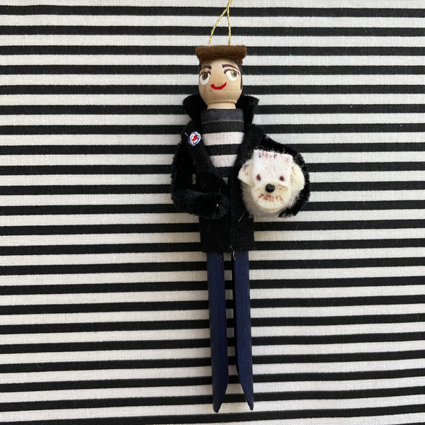 Clothespin ornament of Jake Rudh, the Minneapolis-based club and radio DJ known for his esteemed and highly-regarded "Transmission" program. His dog Harry makes cameos during online shows.