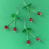 Cherries ornament made from green wire, plastic leaves, and vintage glass beads. 3" tall. 
